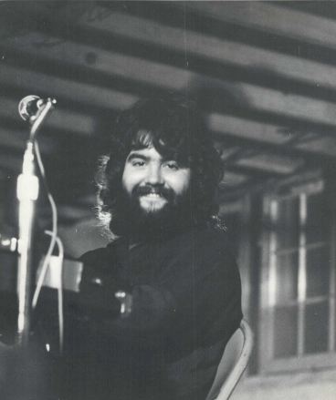 Black and white image of Rick Panyard of Good Seed Band playing live in the mid 1970s